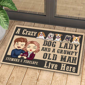 A Crazy Dog Lady And Her Grumpy Old Man Live Here - Personalized Decorative Mat.