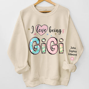 I Love Being Gigi - Family Personalized Custom Unisex Sweatshirt With Design On Sleeve - Christmas Gift For Mom, Grandma