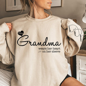 Grandma Wears Her Heart On Her Sleeve - Family Personalized Custom Unisex Sweatshirt With Design On Sleeve - Christmas Gift For Mom, Grandma