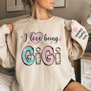 I Love Being Gigi - Family Personalized Custom Unisex Sweatshirt With Design On Sleeve - Christmas Gift For Mom, Grandma