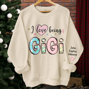 I Love Being Gigi - Family Personalized Custom Unisex Sweatshirt With Design On Sleeve - Christmas Gift For Mom, Grandma