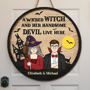 A Wicked Witch And Her Handsome Devil Live Here - Couple Personalized Custom Round Shaped Home Decor Witch Wood Sign - Halloween Gift For Witches, Husband Wife
