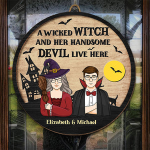 A Wicked Witch And Her Handsome Devil Live Here - Couple Personalized Custom Round Shaped Home Decor Witch Wood Sign - Halloween Gift For Witches, Husband Wife