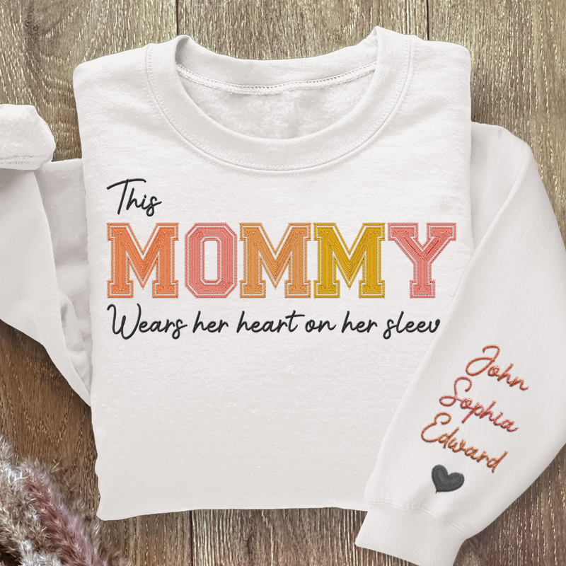Wears Her Heart On Her Sleeve - Family Personalized Custom Unisex Embroidered Sweatshirt With Design On Sleeve - Gift For Mom, Grandma