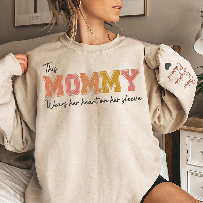 Wears Her Heart On Her Sleeve - Family Personalized Custom Unisex Embroidered Sweatshirt With Design On Sleeve - Gift For Mom, Grandma