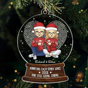 Annoying Each Other And Still Going Strong - Couple Personalized Custom Ornament - Acrylic Snow Globe Shaped - Christmas Gift For Husband Wife, Anniversary