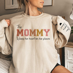 Grandma's Heart Belongs To - Family Personalized Custom Unisex Sweatshirt With Design On Sleeve - Gift For Grandma, Mom