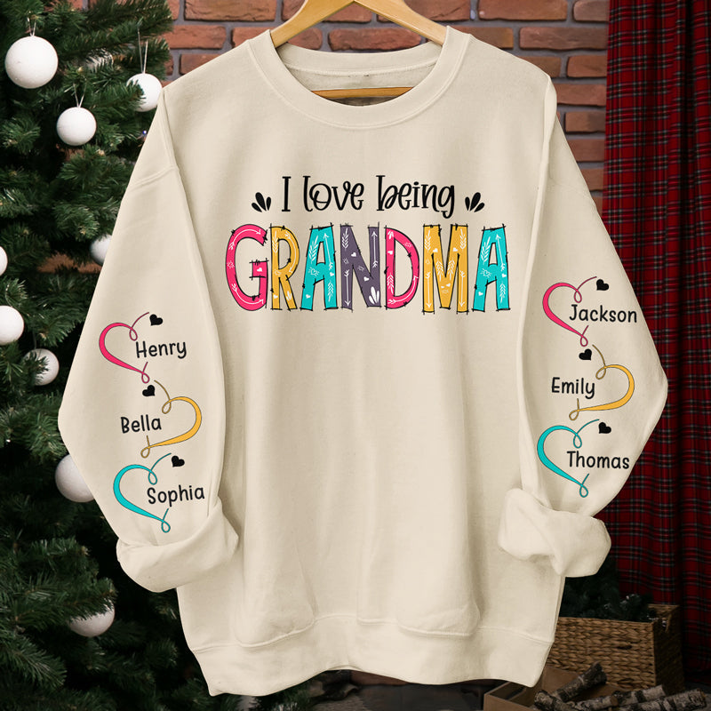 I Love Being Grandma - Family Personalized Custom Unisex Sweatshirt With Design On Sleeve - Christmas Gift For Mom, Grandma