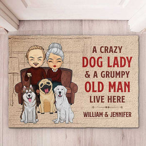 A Crazy Dog Lady And Her Grumpy Old Man Live Here - Personalized Decorative Mat.