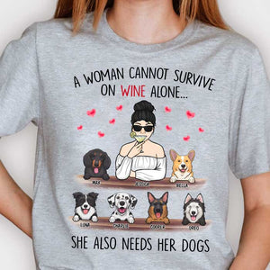 A Woman Cannot Survive On Wine Alone, She Also Needs Her Dogs - Personalized Unisex T-Shirt.