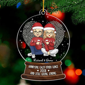 Annoying Each Other And Still Going Strong - Couple Personalized Custom Ornament - Acrylic Snow Globe Shaped - Christmas Gift For Husband Wife, Anniversary